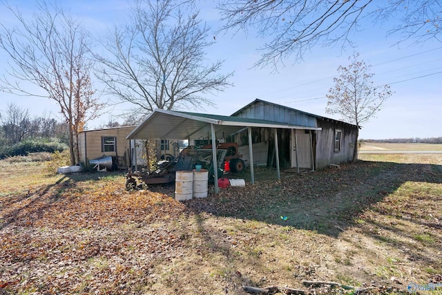 view of outbuilding with a carport