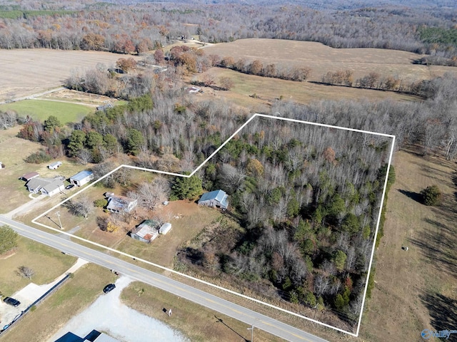 birds eye view of property with a rural view