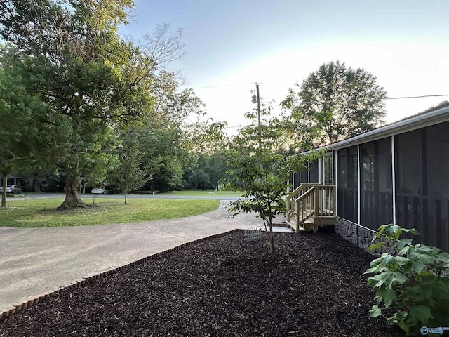 view of yard with a sunroom