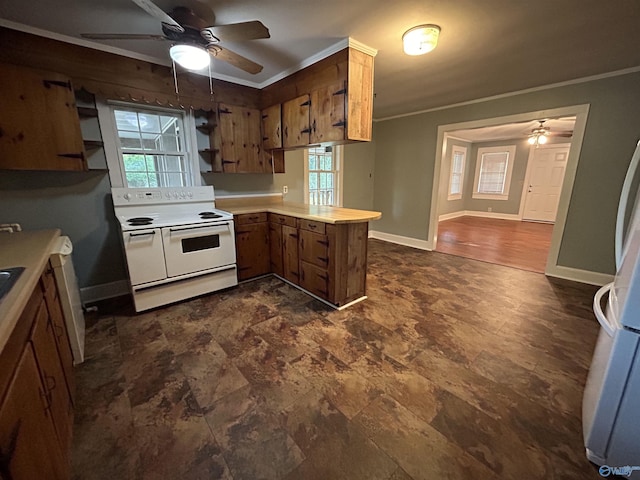 kitchen with white appliances, light countertops, crown molding, and a peninsula