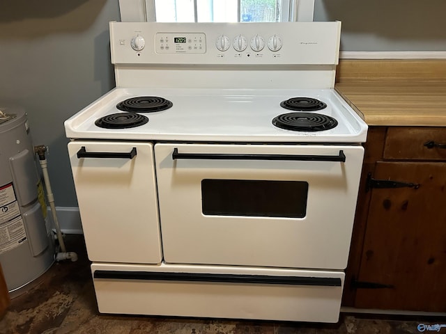 kitchen featuring water heater, light countertops, and white range with electric cooktop