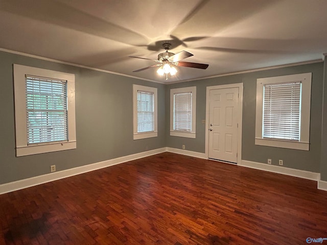 foyer entrance featuring ceiling fan, crown molding, and dark wood-type flooring