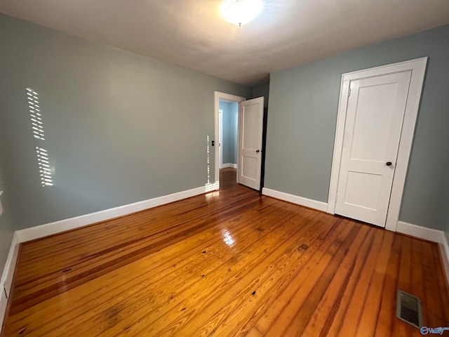 unfurnished bedroom featuring hardwood / wood-style floors