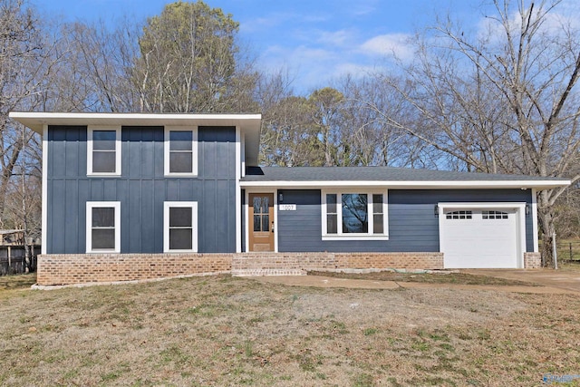 view of front of house featuring a garage and a front lawn