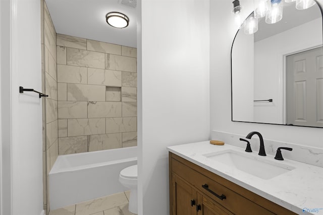 full bathroom with vanity, toilet, and tiled shower / bath combo