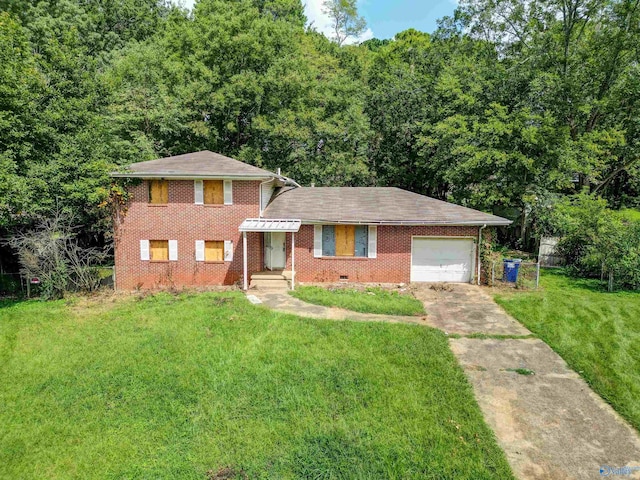 view of front of home with a garage and a front yard