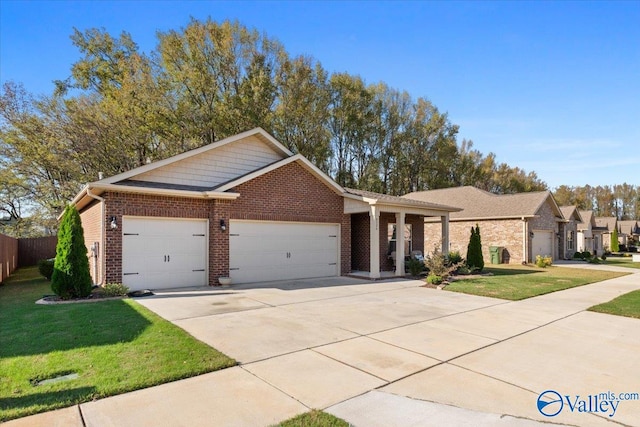 view of front of property featuring a garage and a front lawn