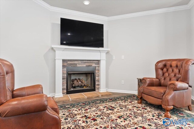 living area with a fireplace and crown molding