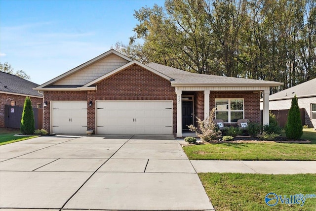 view of front of property featuring a front lawn and a garage