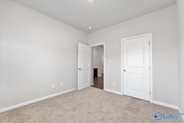 unfurnished bedroom with carpet floors