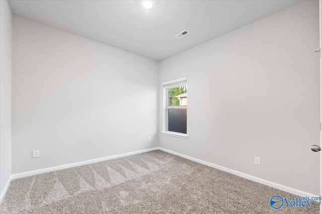 spare room featuring carpet flooring