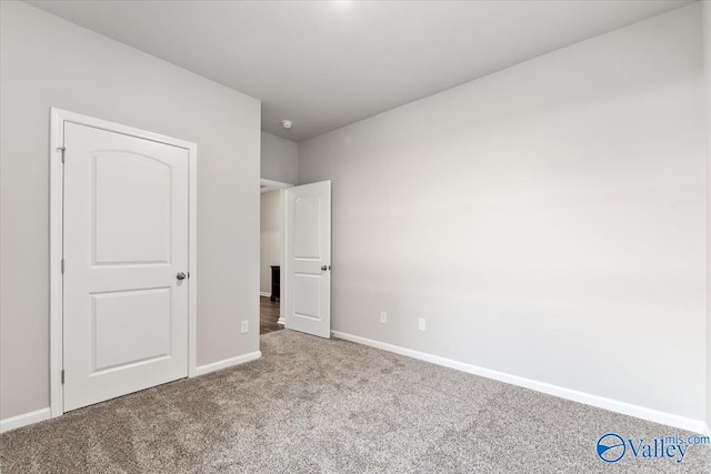 unfurnished bedroom featuring carpet