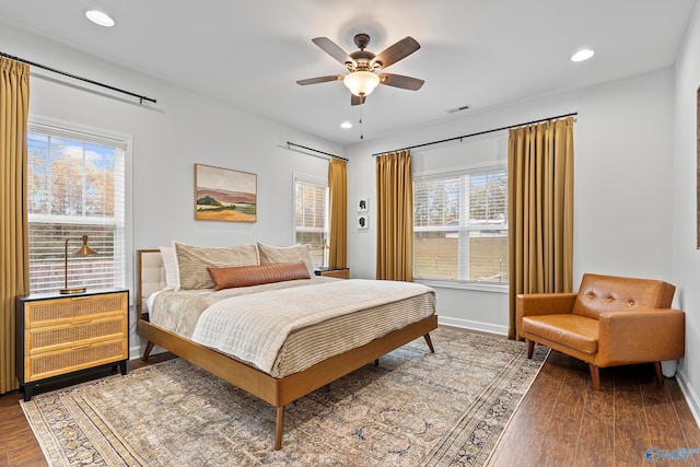 bedroom featuring ceiling fan and dark hardwood / wood-style floors