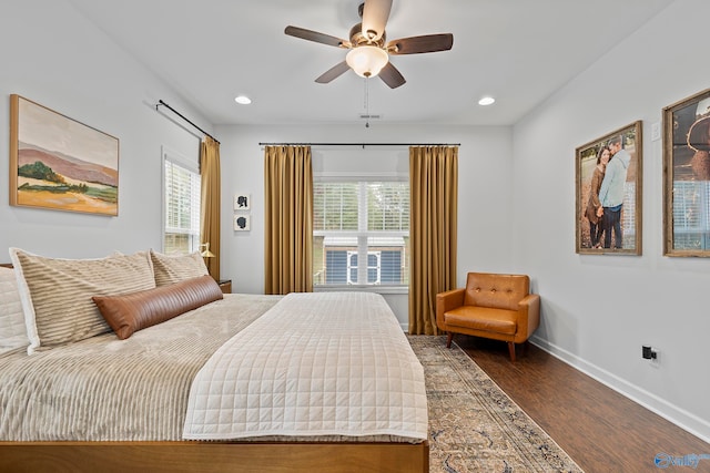 bedroom featuring dark hardwood / wood-style floors and ceiling fan