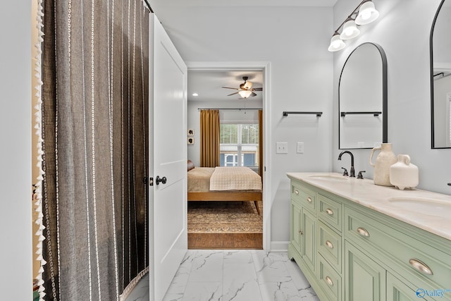 bathroom with ceiling fan and vanity