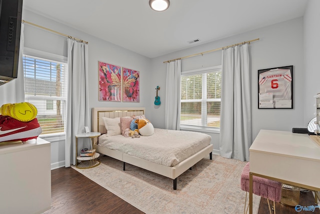 bedroom featuring dark wood-type flooring