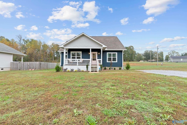 view of front facade with a porch and a front lawn