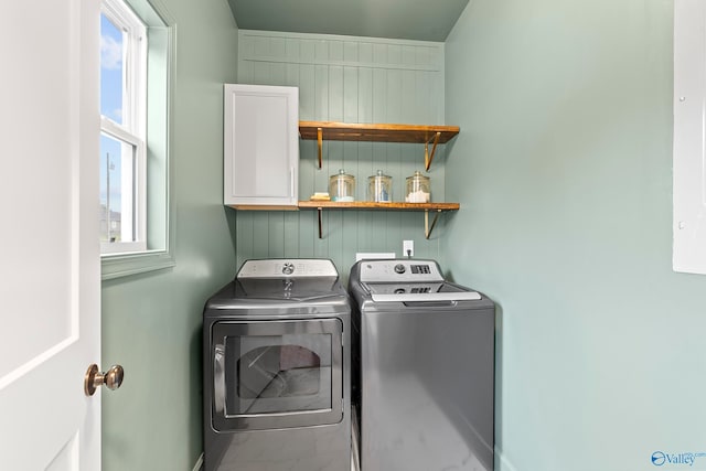 washroom featuring washing machine and dryer