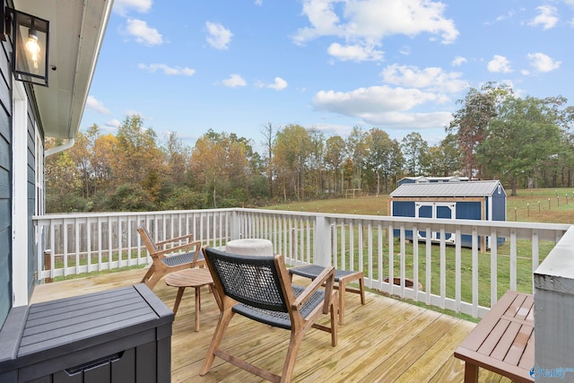 wooden terrace with a lawn and a storage unit