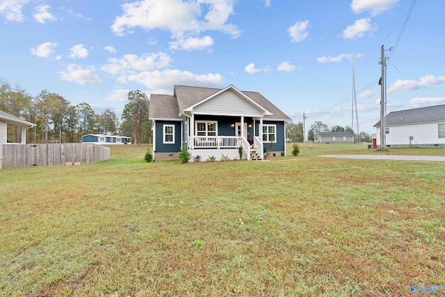 view of front of property with a front lawn and covered porch