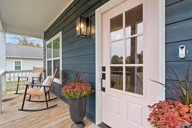 doorway to property featuring covered porch