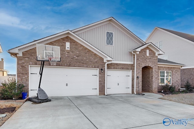 traditional-style home with concrete driveway and brick siding