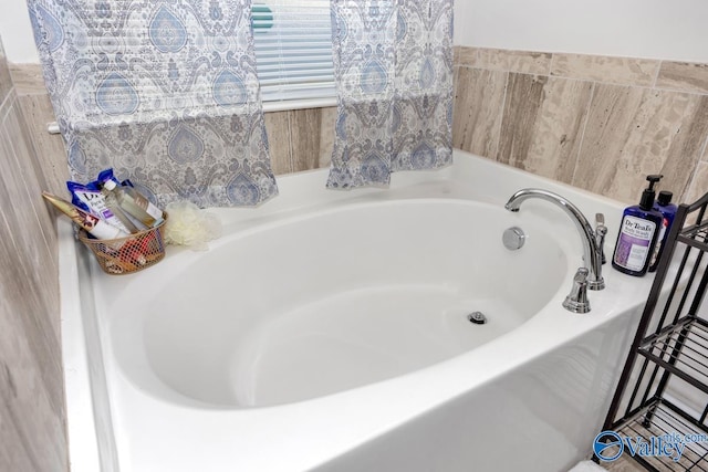 bathroom with a garden tub