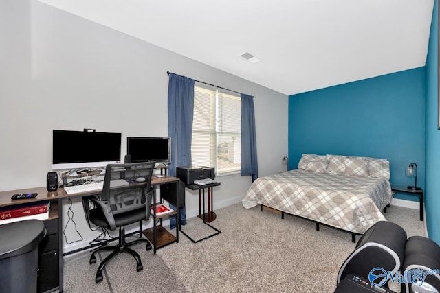 carpeted bedroom with baseboards and visible vents