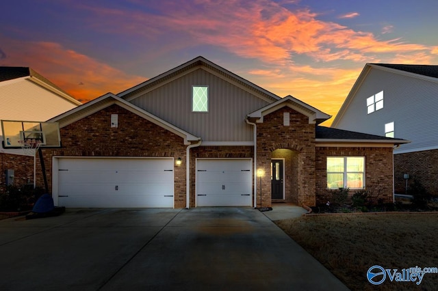 traditional-style home with a garage, driveway, and board and batten siding