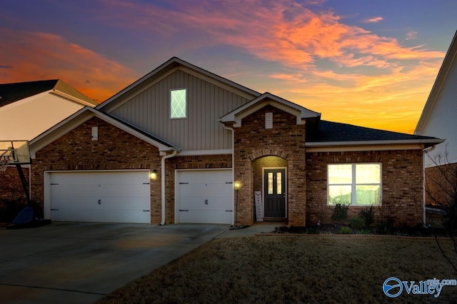 traditional home featuring concrete driveway, board and batten siding, an attached garage, and roof with shingles