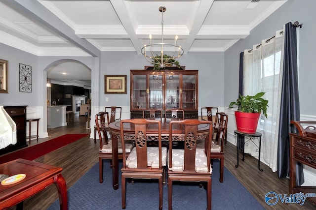 dining room with arched walkways, a chandelier, dark wood-style flooring, coffered ceiling, and beam ceiling