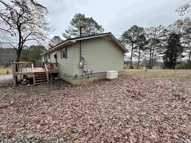 view of property exterior featuring a deck