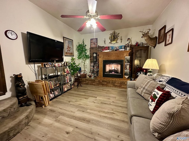 living room featuring light hardwood / wood-style flooring and ceiling fan