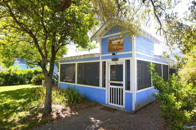 1411 Jones Ave, Tybee Island, GA 31328 - view of property exterior featuring a sunroom