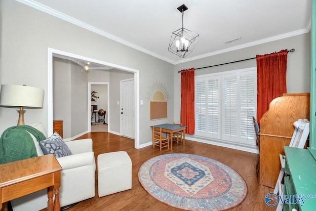 2609 Quarter Ln, Owens Cross Roads, AL 35763 - sitting room with a chandelier, baseboards, wood finished floors, visible vents, and ornamental molding