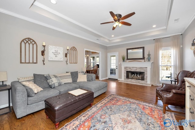 2609 Quarter Ln, Owens Cross Roads, AL 35763 - living room with crown molding, wood finished floors, baseboards, a raised ceiling, and a ceiling fan