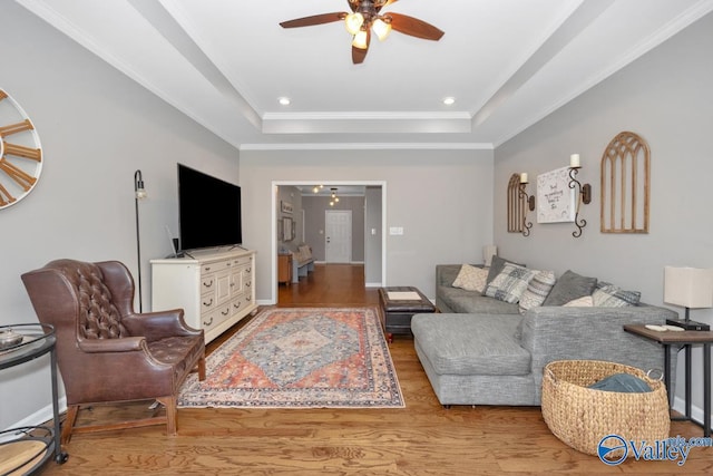 2609 Quarter Ln, Owens Cross Roads, AL 35763 - living area featuring crown molding, wood finished floors, recessed lighting, a raised ceiling, and a ceiling fan