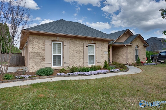 2609 Quarter Ln, Owens Cross Roads, AL 35763 - single story home featuring fence, a shingled roof, a front lawn, and brick siding