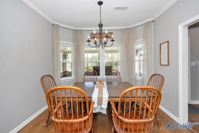 2609 Quarter Ln, Owens Cross Roads, AL 35763 - dining space with baseboards, a notable chandelier, visible vents, and wood finished floors