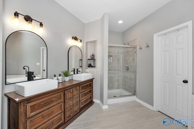 2609 Quarter Ln, Owens Cross Roads, AL 35763 - full bathroom featuring a sink, baseboards, a stall shower, and double vanity