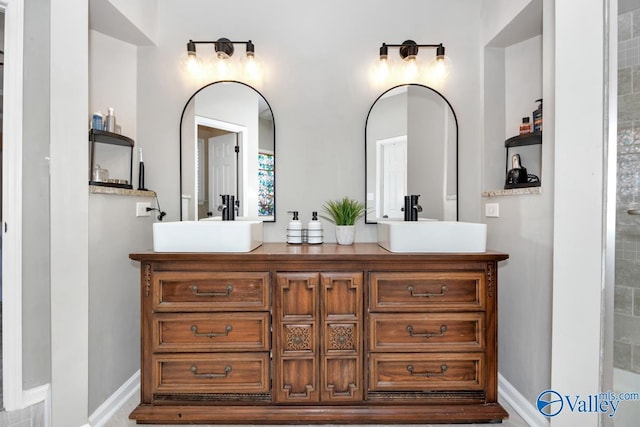 2609 Quarter Ln, Owens Cross Roads, AL 35763 - bathroom featuring a sink and double vanity