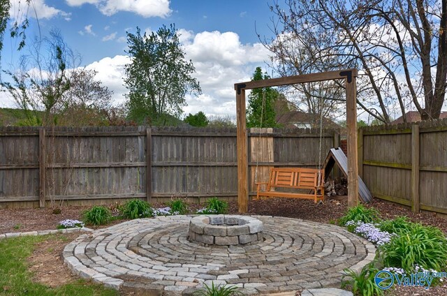 2609 Quarter Ln, Owens Cross Roads, AL 35763 - view of yard featuring a patio, a fenced backyard, and a fire pit