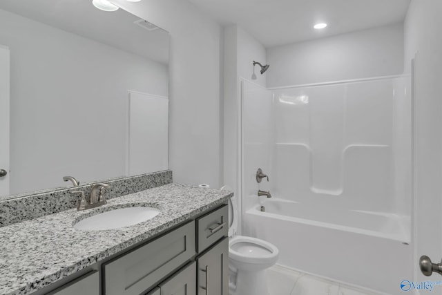 bathroom featuring toilet, visible vents, vanity, and washtub / shower combination