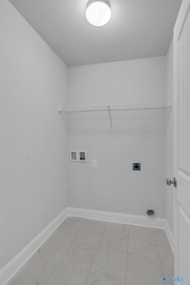 laundry room featuring marble finish floor, hookup for a washing machine, electric dryer hookup, laundry area, and baseboards