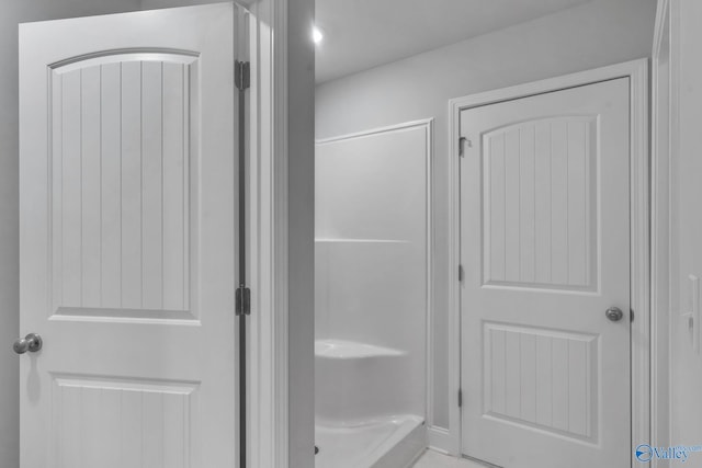 interior space featuring walk in shower