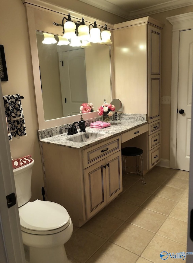 bathroom featuring ornamental molding, tile patterned floors, toilet, and vanity