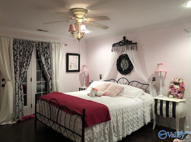 bedroom featuring crown molding, ceiling fan, and dark hardwood / wood-style flooring