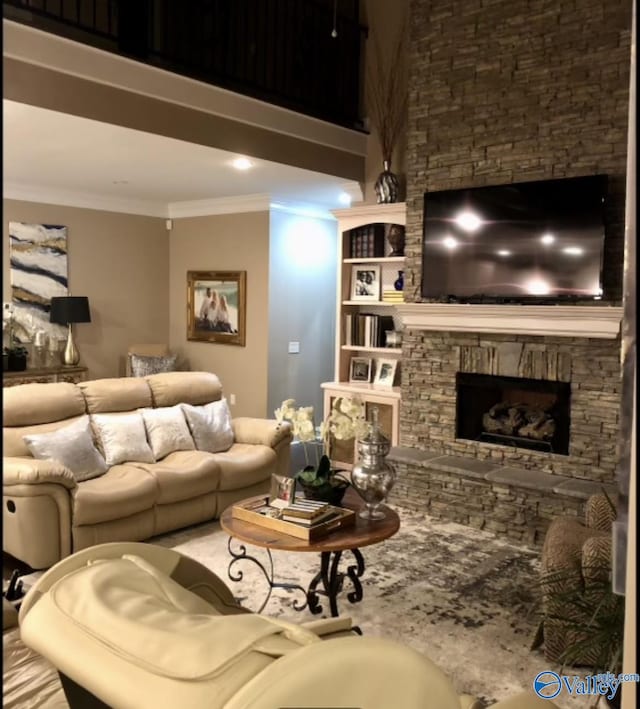 living room featuring a fireplace and crown molding