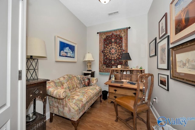 sitting room with hardwood / wood-style floors