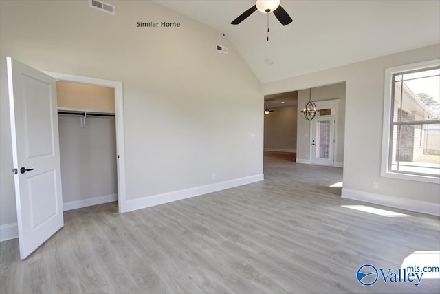 FLAGSTAFF-B Newby Chapel Rd, Athens, AL 35613 - unfurnished bedroom featuring a chandelier, baseboards, light wood-type flooring, ceiling fan, and high vaulted ceiling